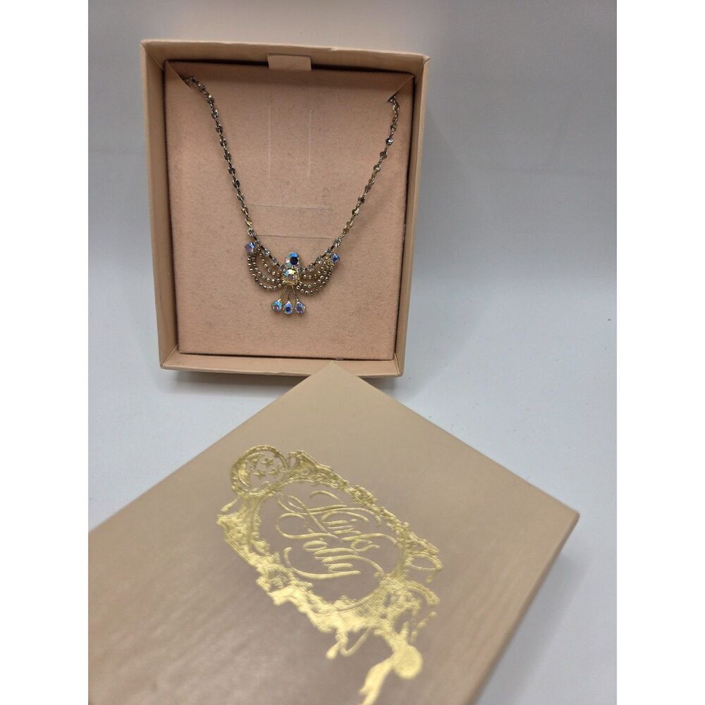 1813.  Kirks Folly Gold Tone Rhinestone Angle Necklace